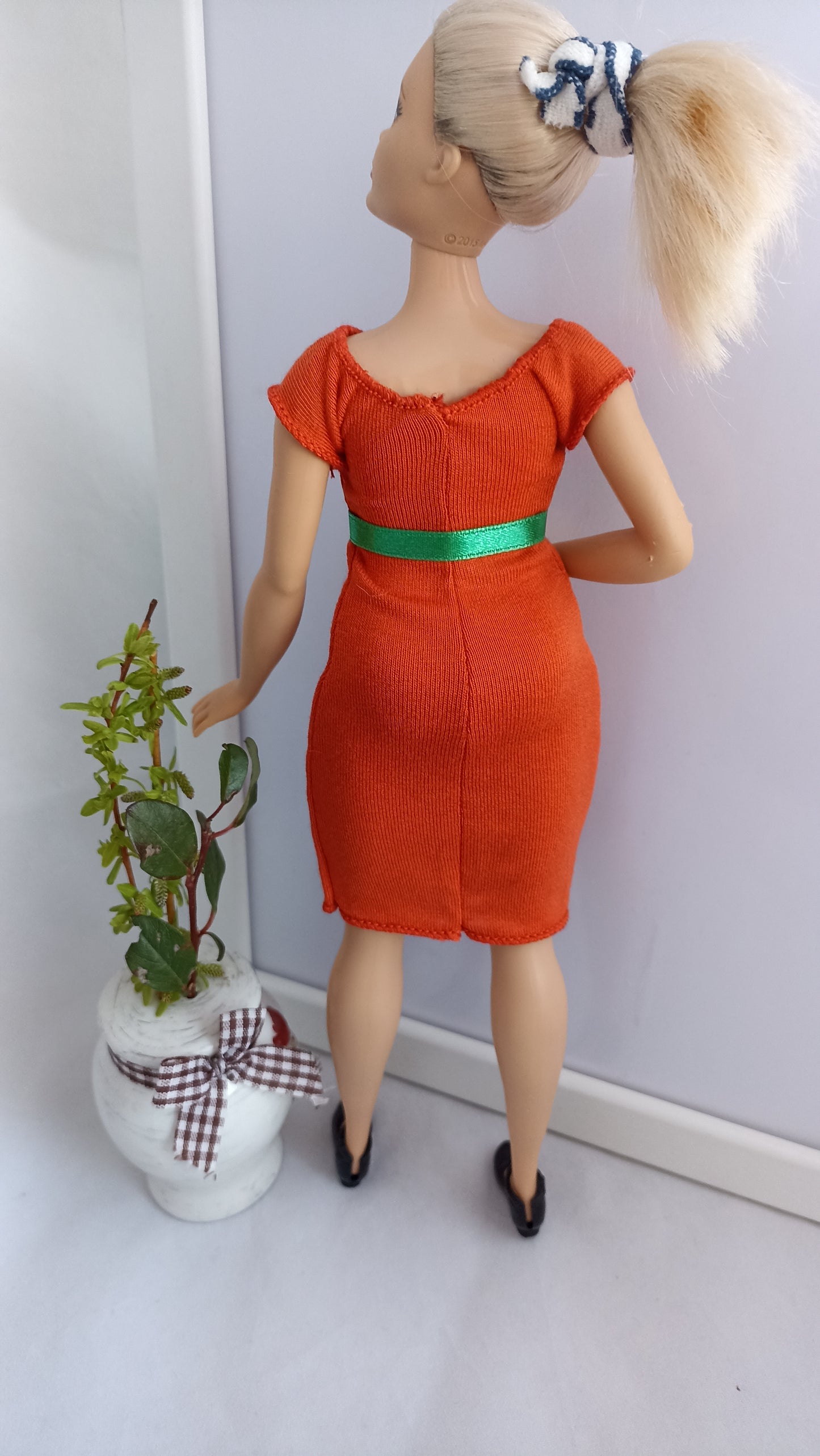 Curvy doll dress orange color with a green belt, stretch.